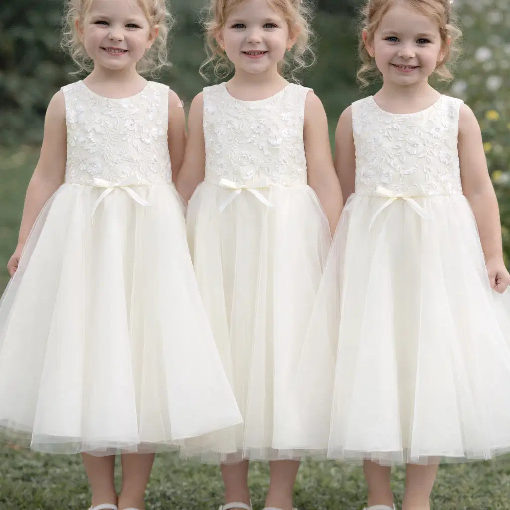 three models wearing a Classic Ivory Flower Girl Dress With Lace and tulle image 9