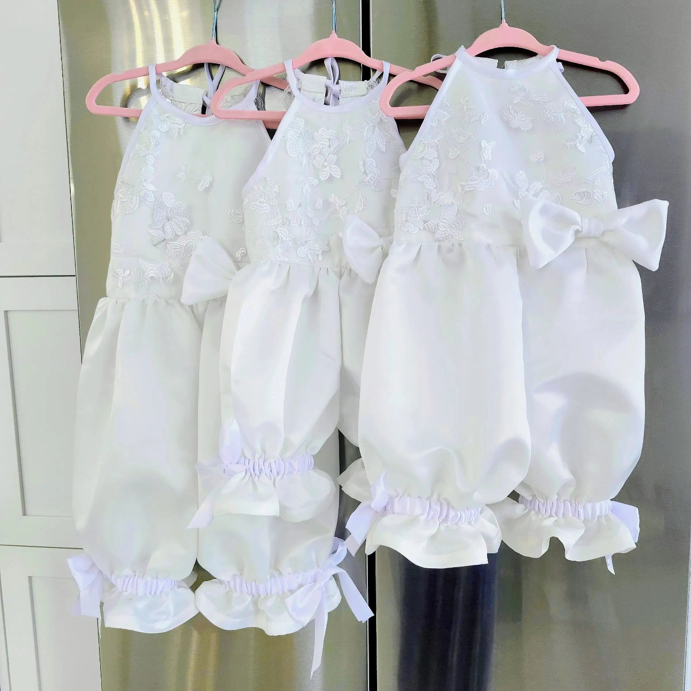 three Flower girl Romper with Pantaloons hanging from pink hangers image 7