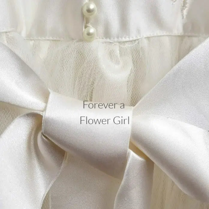 Close up view of pearl buttons on Silk Flower Girl Dress image 5