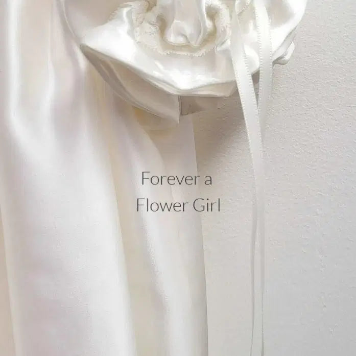 Ribbon detail on a sleeve of a Silk Satin Flower Girl Dress image 5
