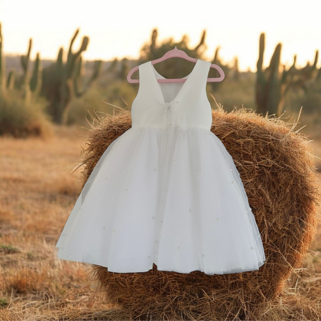 back view of Elegant Flower Girl Dress in a country setting image 3