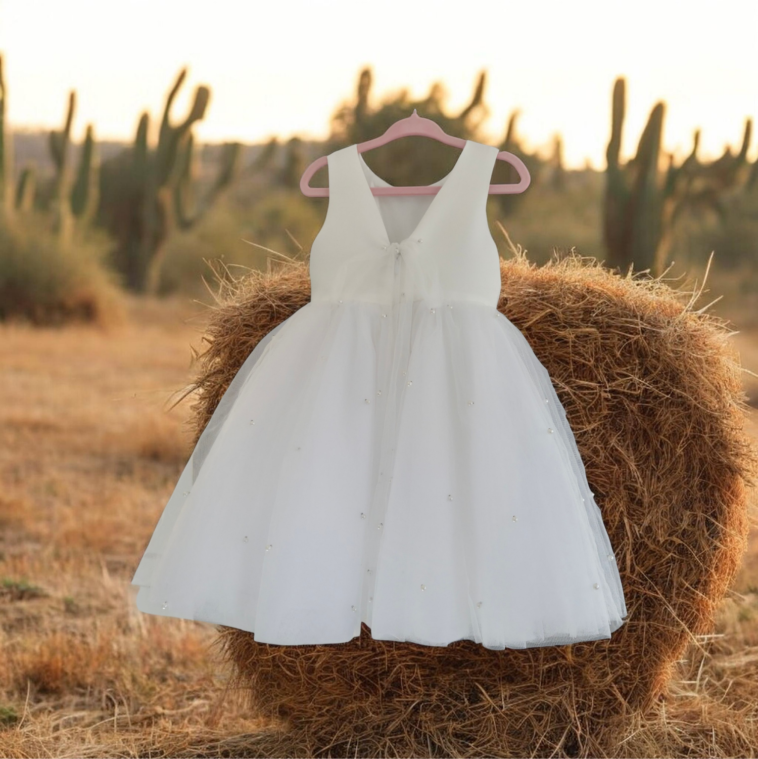 back view of Elegant Flower Girl Dress in a country setting image 3