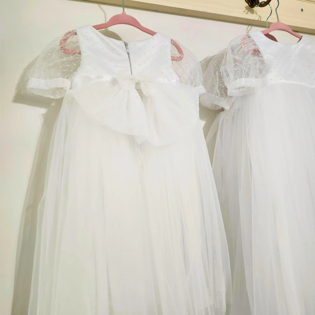 back view of large bow on a White flower girl Dress image 1