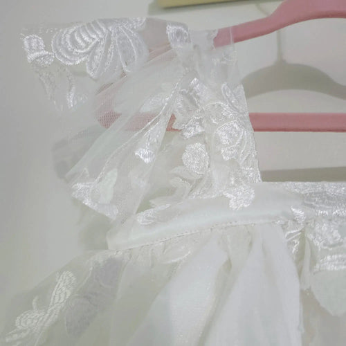 close up view of flutter sleeves on Babydoll Flower Girl Dresses image 1