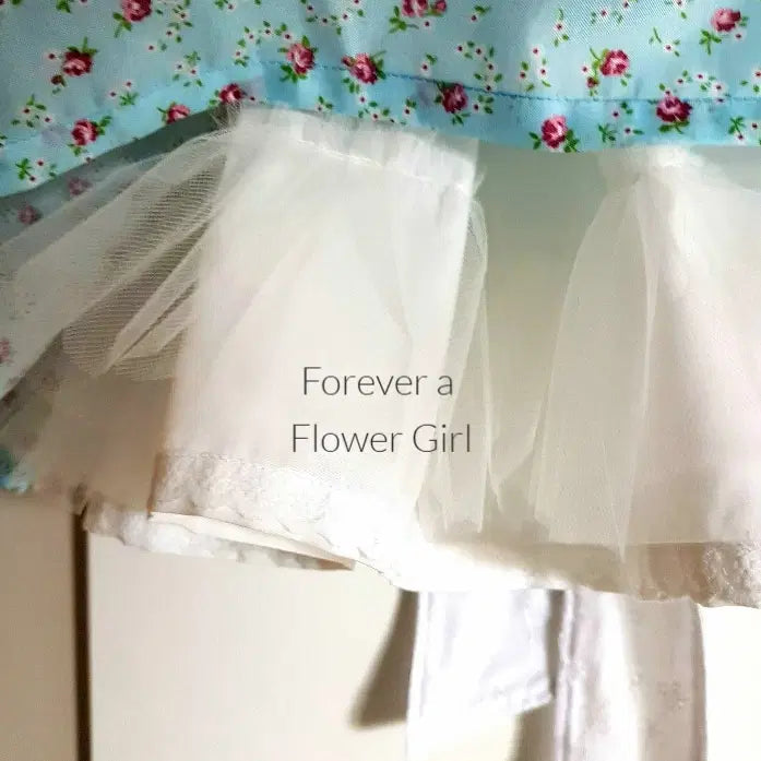 close up view of the hem on a Floral Cotton flower girl dress image 1