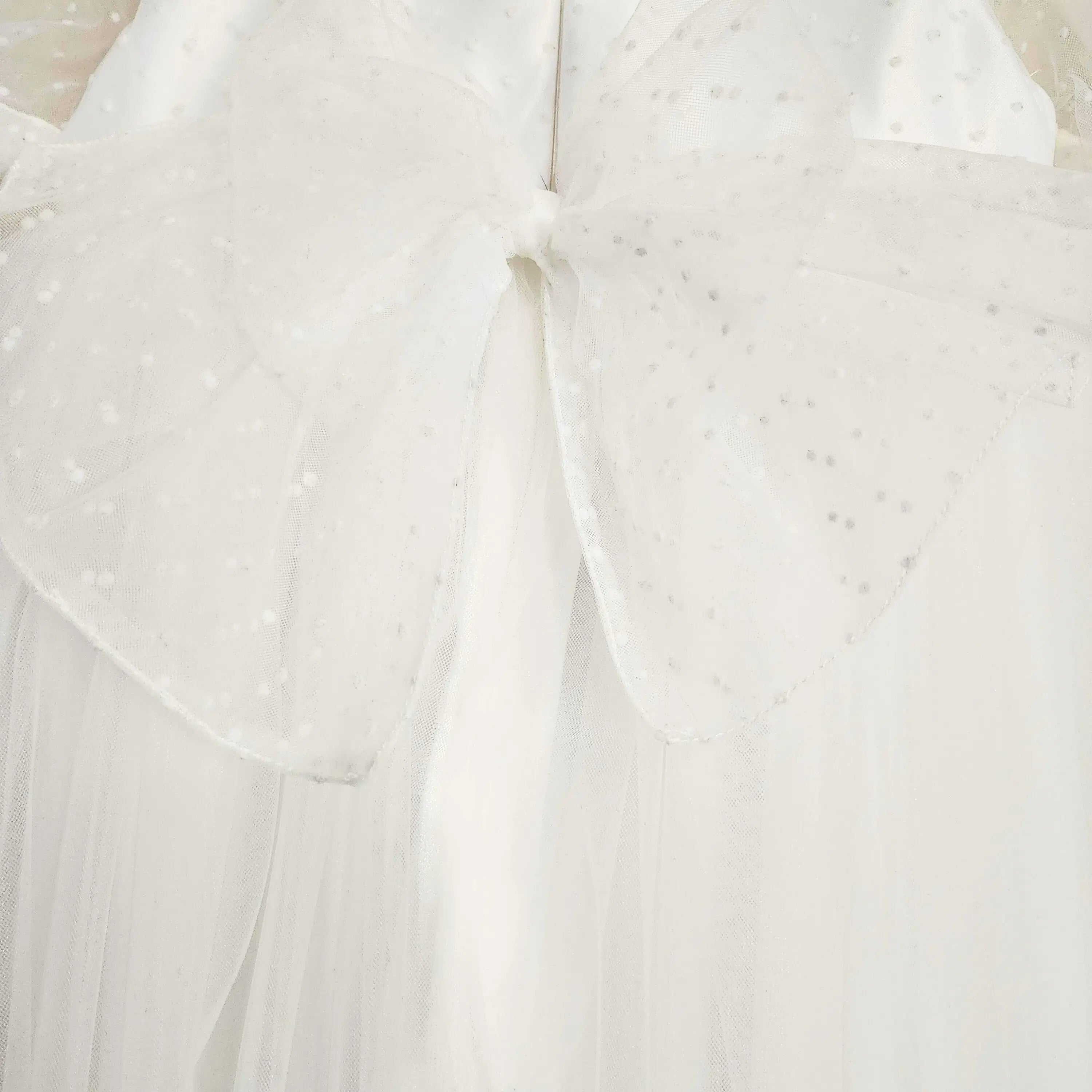 close up view of large bow on White flower girl dress Dress image 2