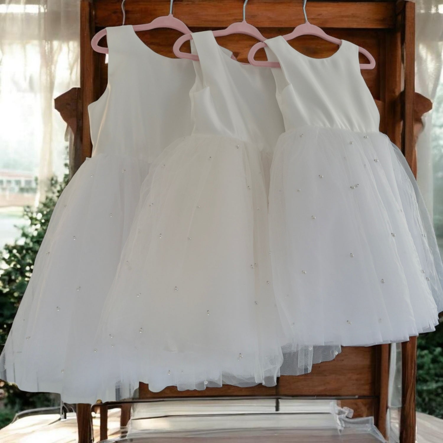 side view of Elegant Flower Girl Dresses with pink hangers image 2