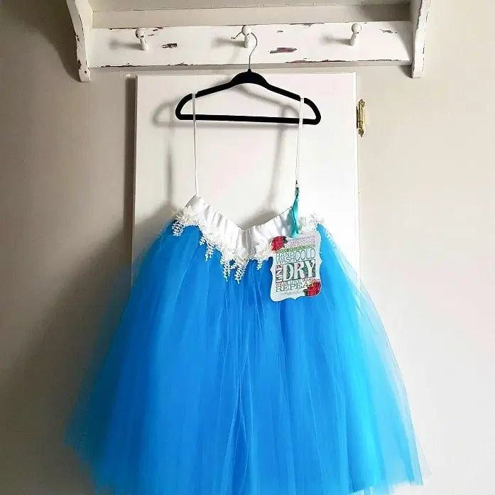 Turquoise Tutu Skirt For Girls hanging on a hook image 1