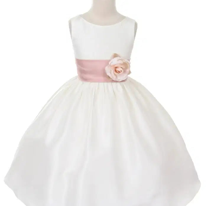 White satin flower girl dress with pink sash on a mannequin image 1