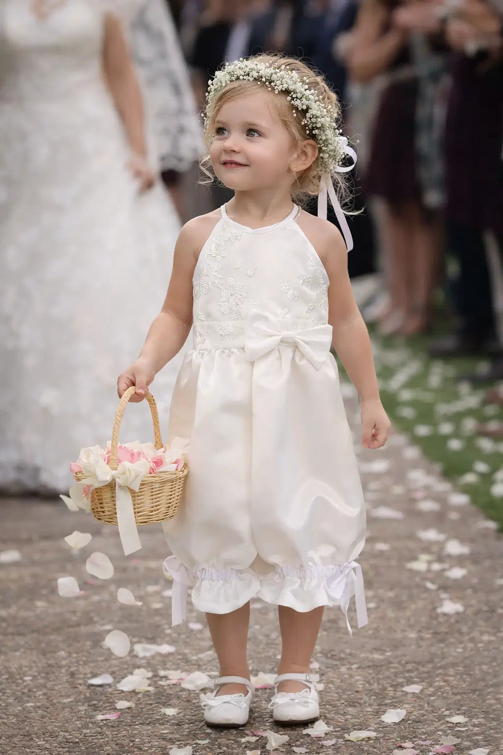 model wearing a Flower girl Romper with Pantaloons and bow image 1