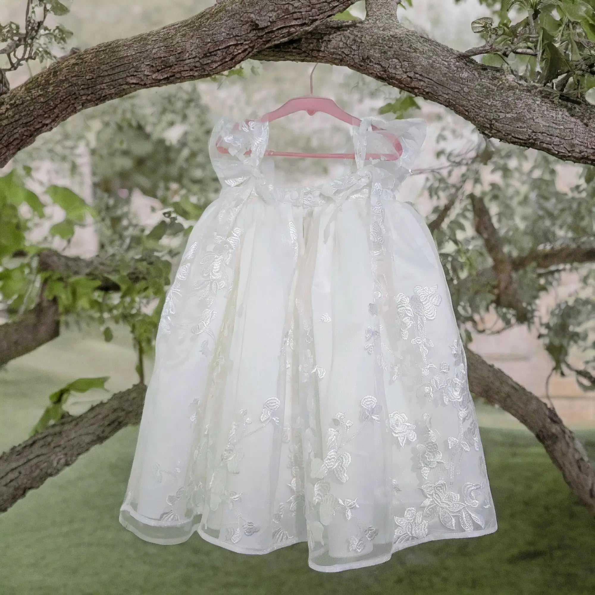 Babydoll Flower Girl Dress hanging from a tree branch image 11