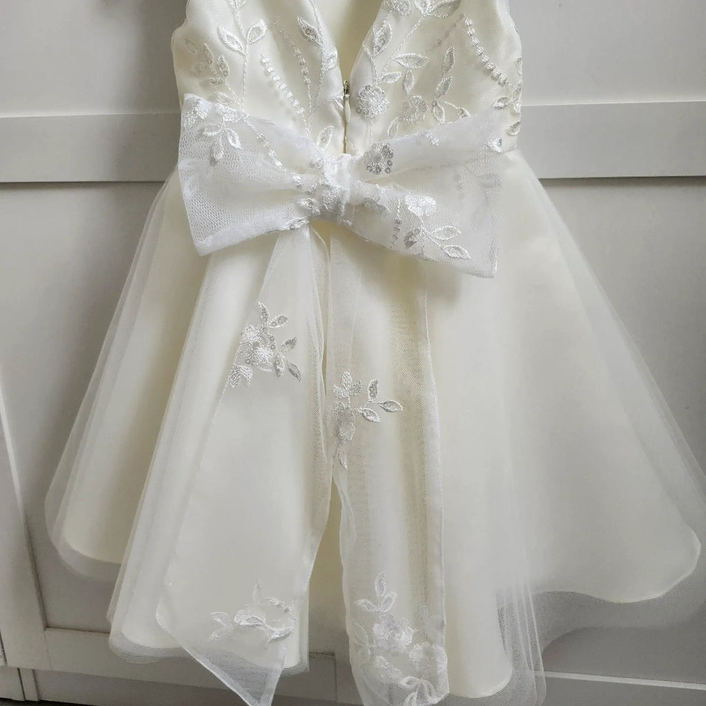 close up view of lace bow on a Classic Ivory Flower Girl Dress With Tulle  image 5