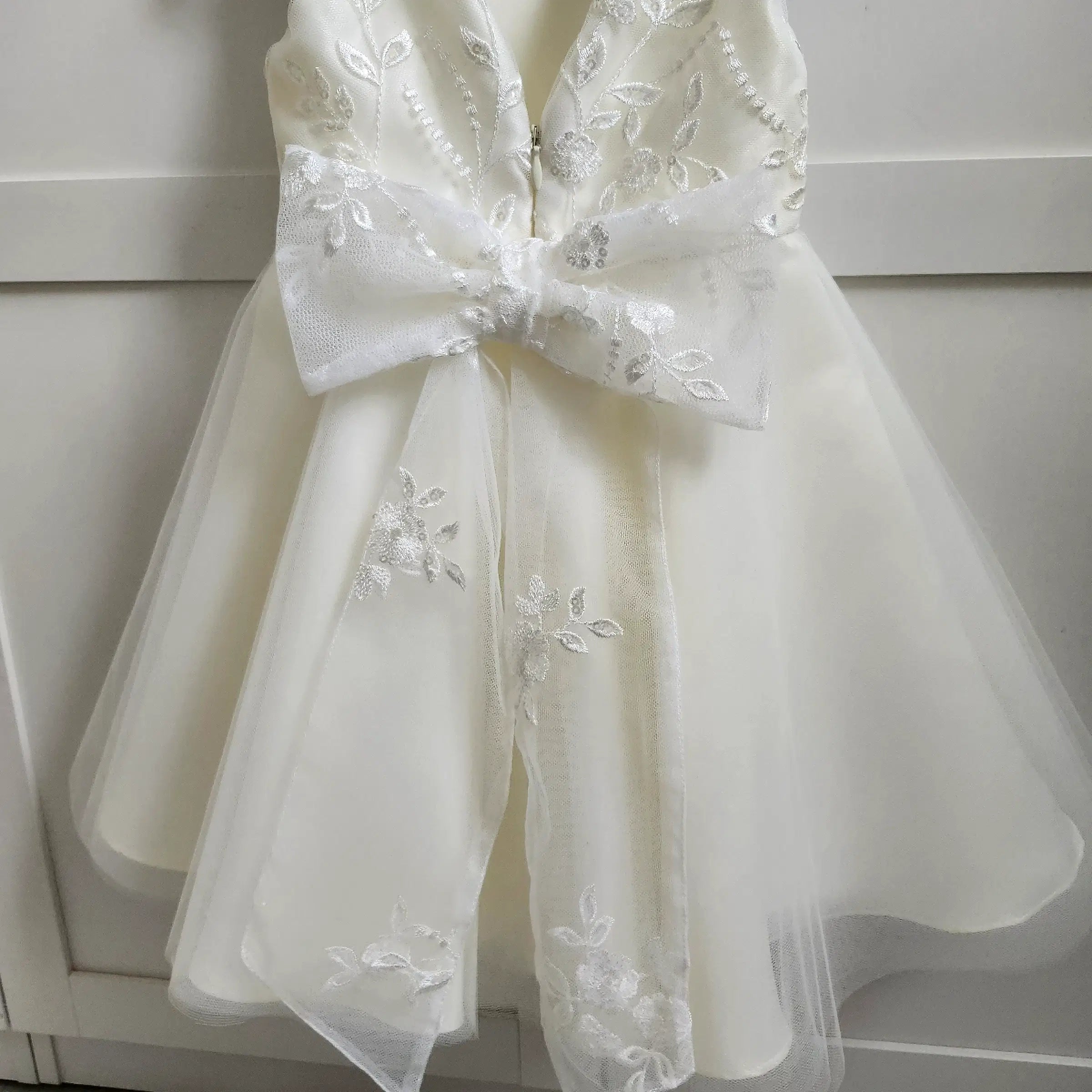 close up view of lace bow on a Classic Ivory Flower Girl Dress With Tulle  image 5