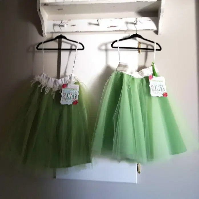 two Green Tutu Skirts hanging on a hook image 4
