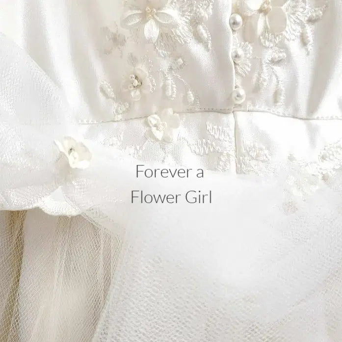 Close up view of Silk Ivory Flower Girl Dress with pearl buttons image 2