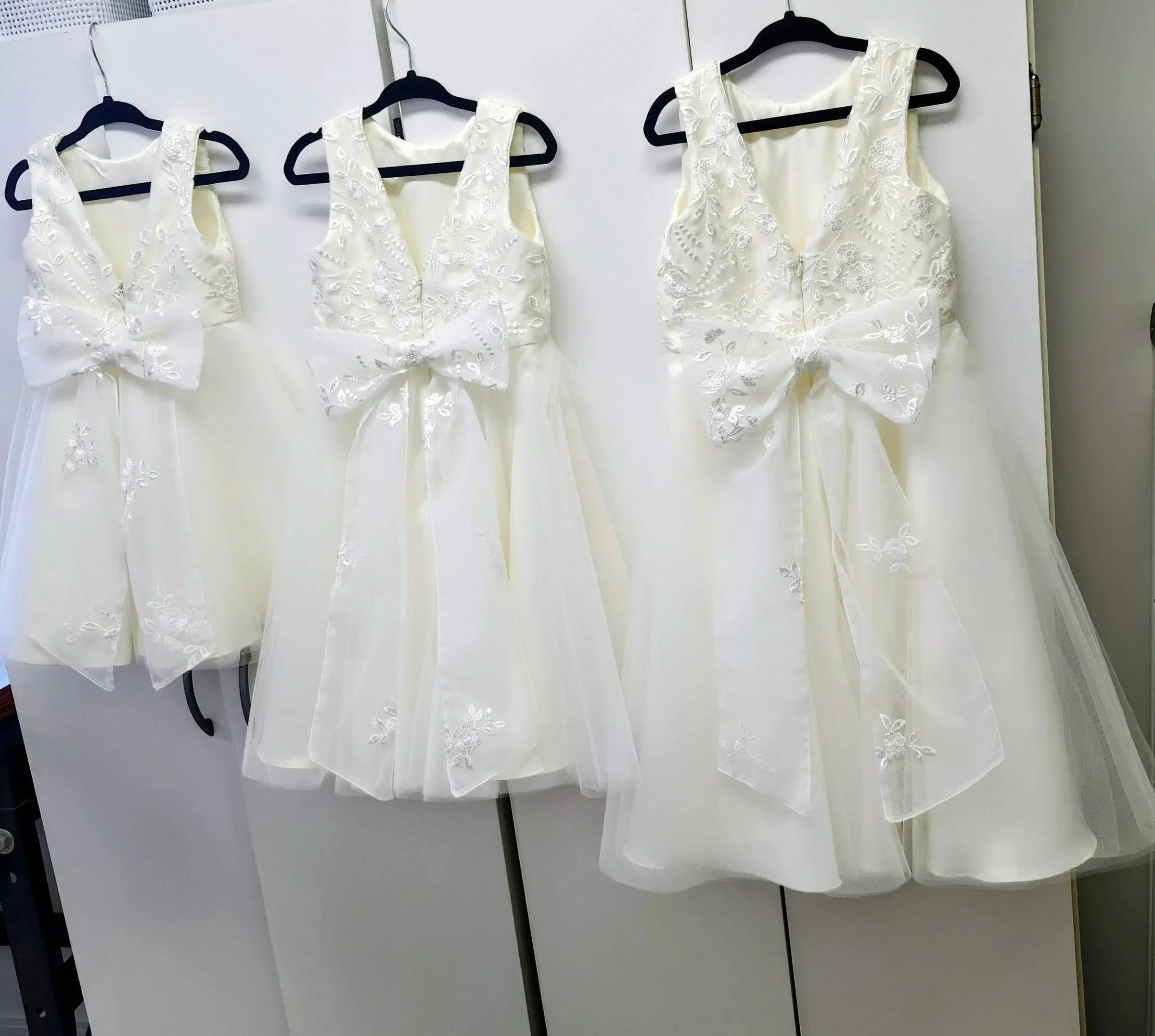 back view of three Classic Ivory Flower Girl Dresses With Tulle and Lace Bow image 8