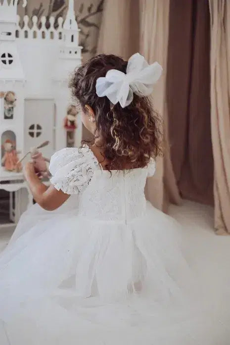 back view of little girl wearing a White Lace Flower Girl Dress image 2