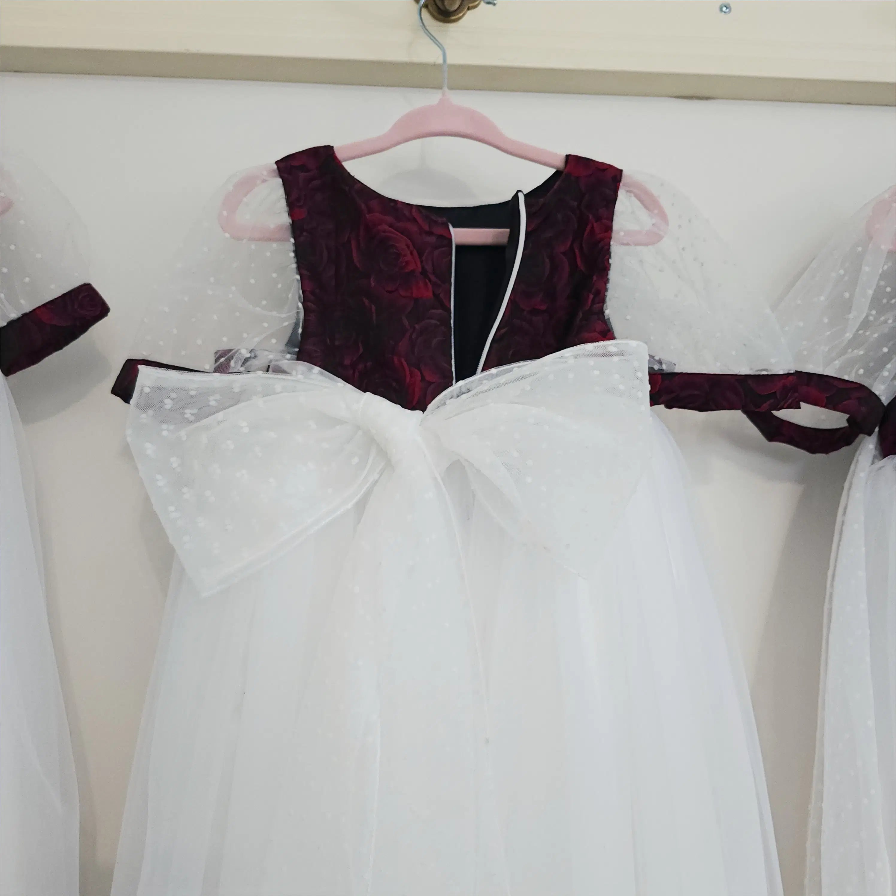 Back view of large bow on a Red and White Flower Girl Dress image 2